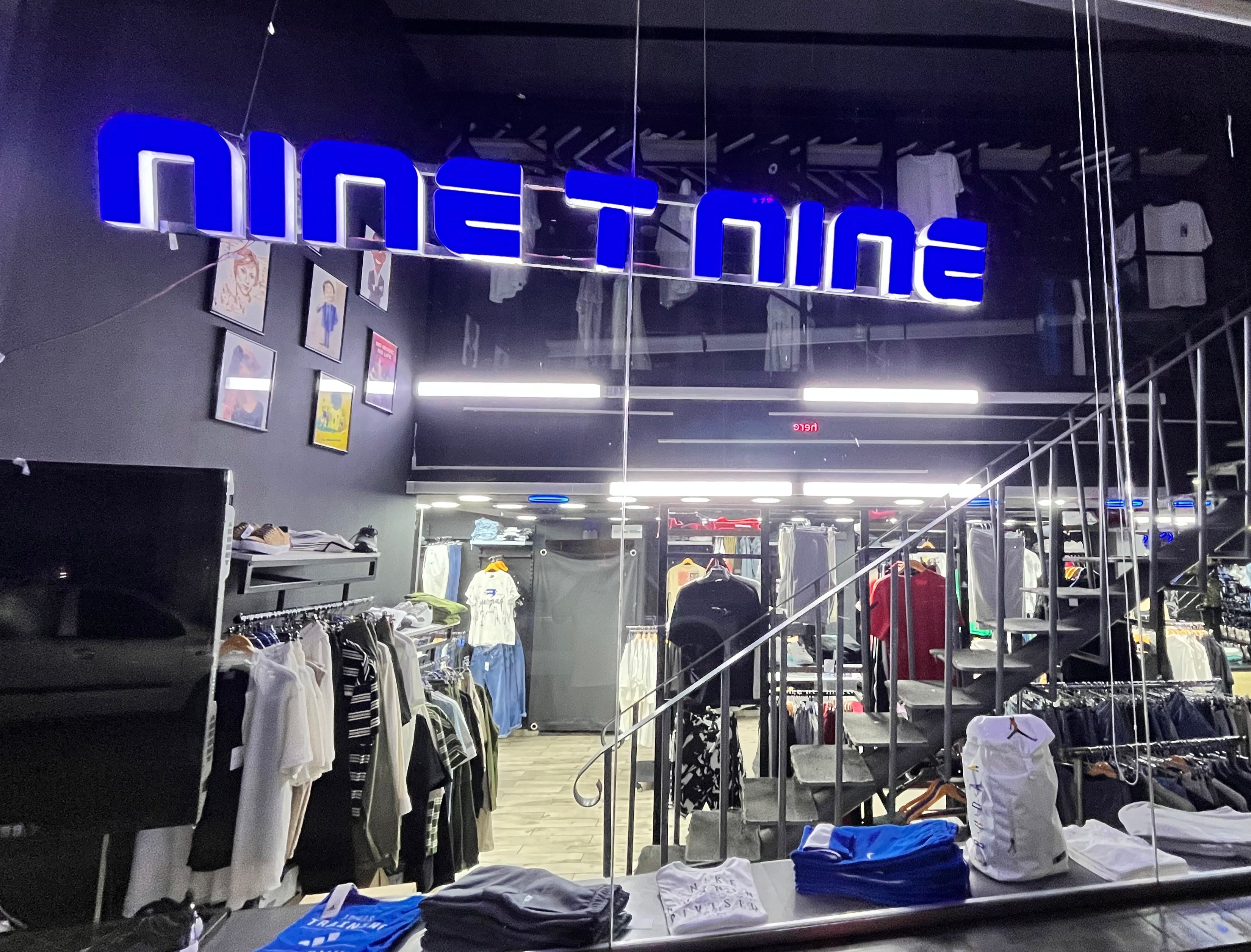 Ninety Nine store front with clothing displayed inside